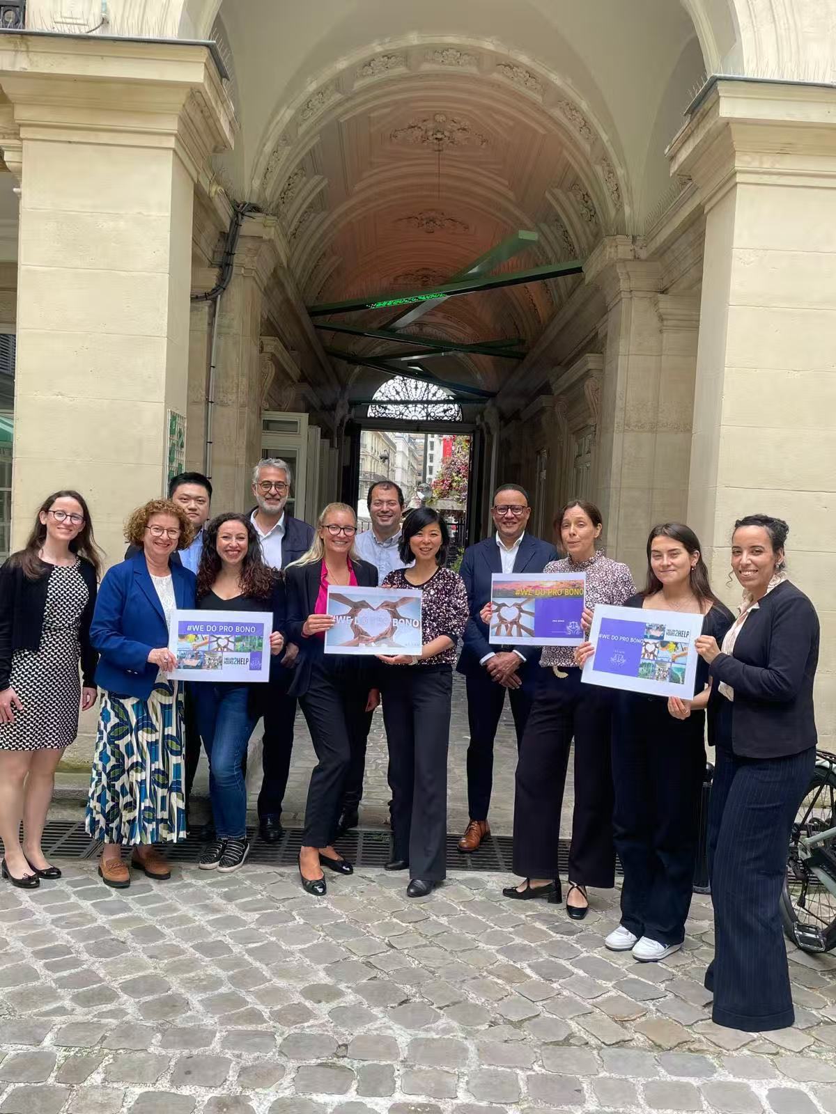BNP Paribas Group LEGAL colleagues with Pro Bono programme signs